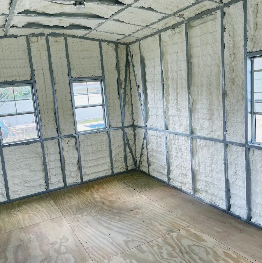 Closed-cell spray foam insulation applied to wall cavities in a residential project in Little Chute